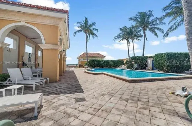 a view of multiple houses with a patio