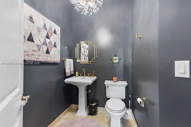 a bathroom with a toilet and a sink