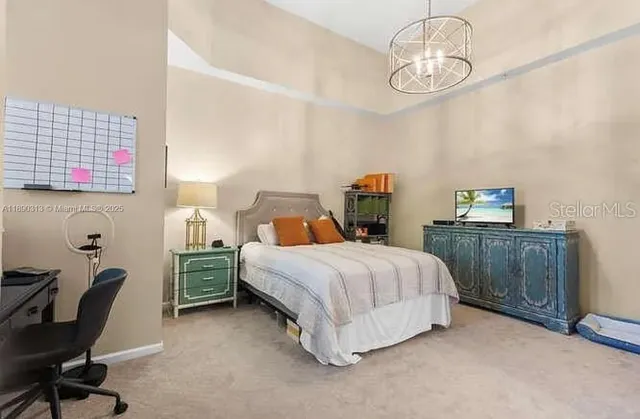 a bedroom with a bed and a table in it