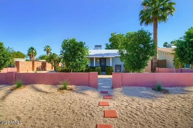 a swimming pool with outdoor seating