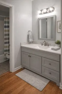 a bathroom with a double vanity sink and a mirror