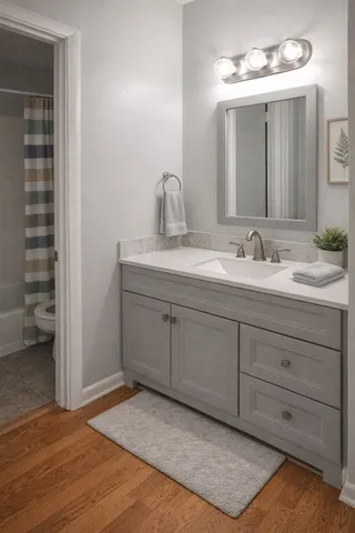 a bathroom with a double vanity sink and a mirror