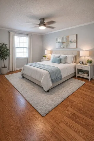 a bedroom with a bed and a window