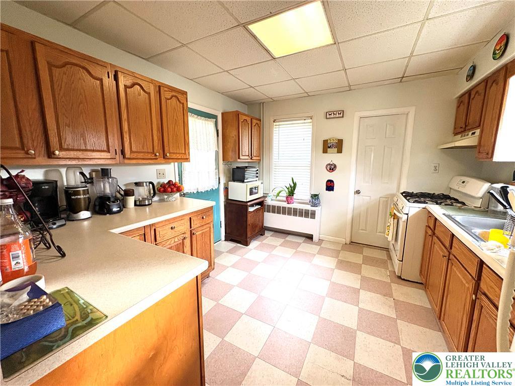 346 Messinger Street Bangor, PA 18013 - Photo 13 of 26 a kitchen with stainless steel appliances a sink a stove a refrigerator cabinets and a dining table