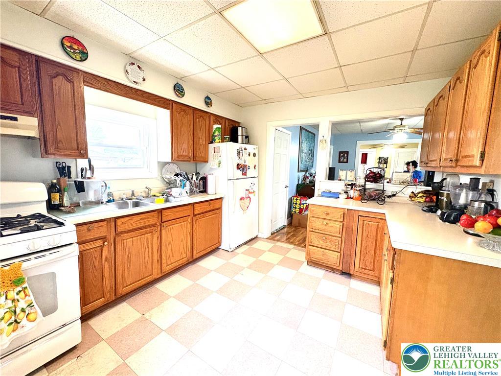 346 Messinger Street Bangor, PA 18013 - Photo 14 of 26 a large kitchen with kitchen island a large counter top space a sink a window and stainless steel appliances