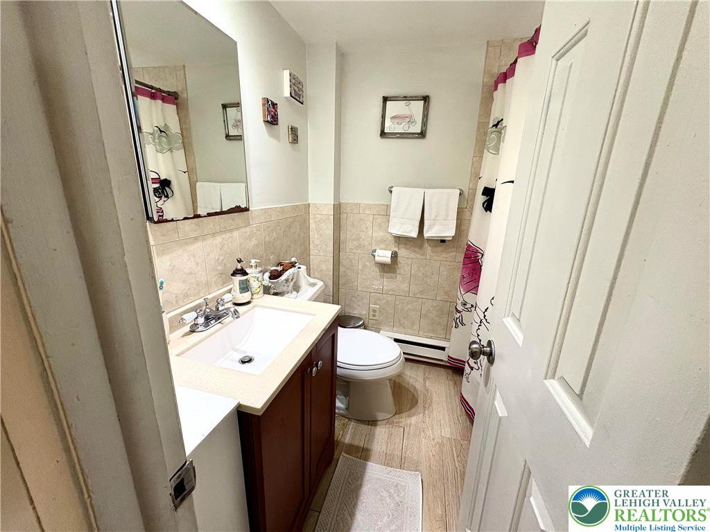 346 Messinger Street Bangor, PA 18013 - Photo 16 of 26 a bathroom with a sink a mirror and a toilet
