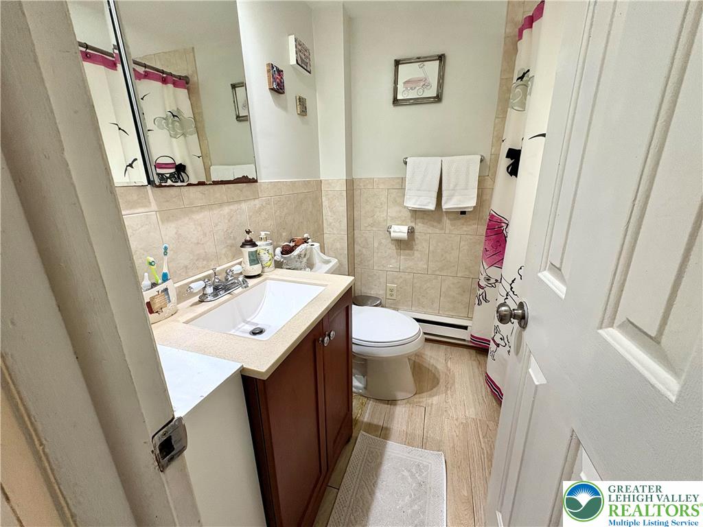 346 Messinger Street Bangor, PA 18013 - Photo 17 of 26 a bathroom with a sink mirror and toilet