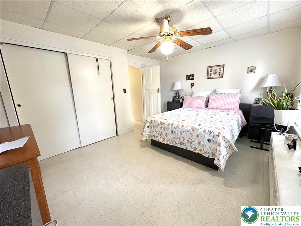 346 Messinger Street Bangor, PA 18013 - Photo 24 of 26 a bedroom with a bed chandelier and a window