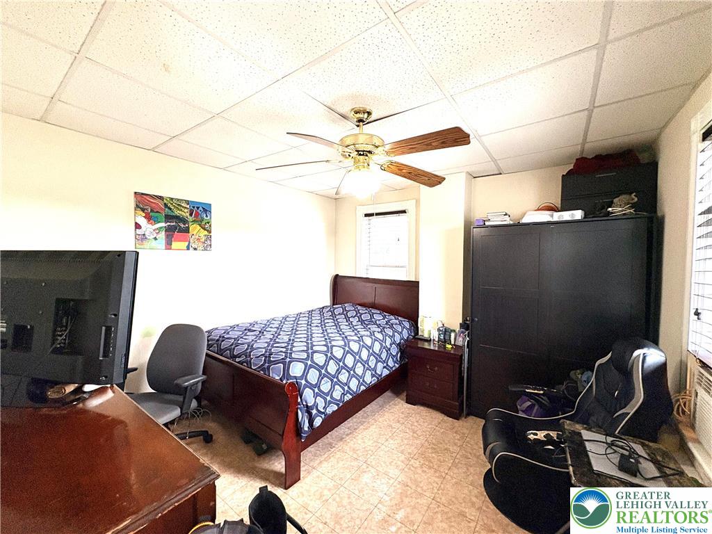 346 Messinger Street Bangor, PA 18013 - Photo 25 of 26 a bedroom with furniture and a chandelier