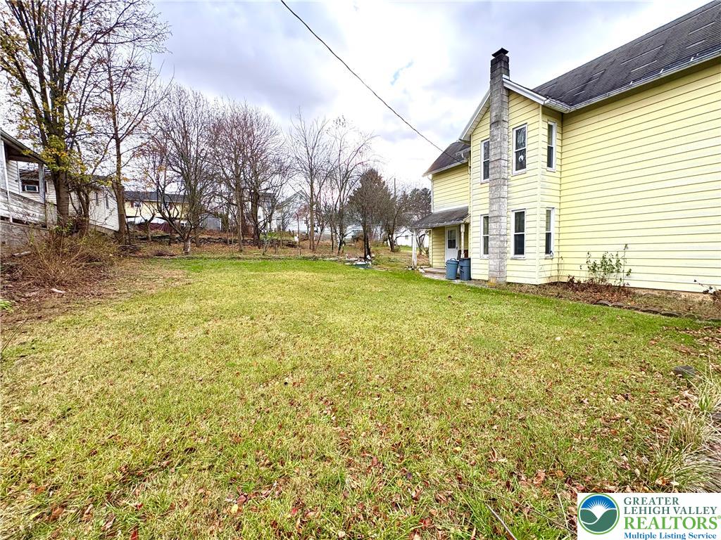 346 Messinger Street Bangor, PA 18013 - Photo 6 of 26 a view of a house with a yard and garage