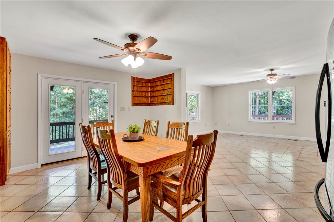 120 Patterson Ridge Road Salem, SC 29676 - Photo 12 of 46 Natural light floods this dining area, featuring porch access and gleaming tiled floors.