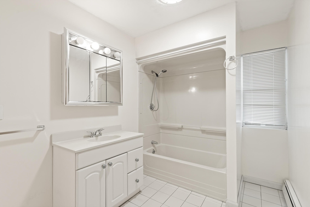 5 Washington Square Gloucester, MA 01930 - Photo 11 of 20 a bathroom with a shower sink vanity and mirror