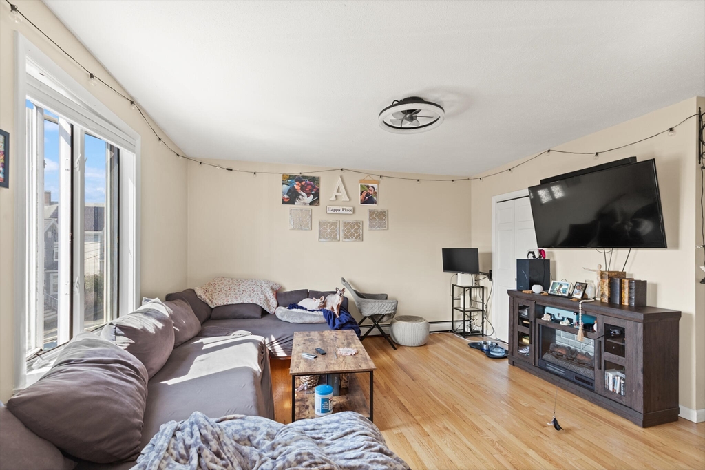 5 Washington Square Gloucester, MA 01930 - Photo 16 of 20 a living room with furniture and a flat screen tv