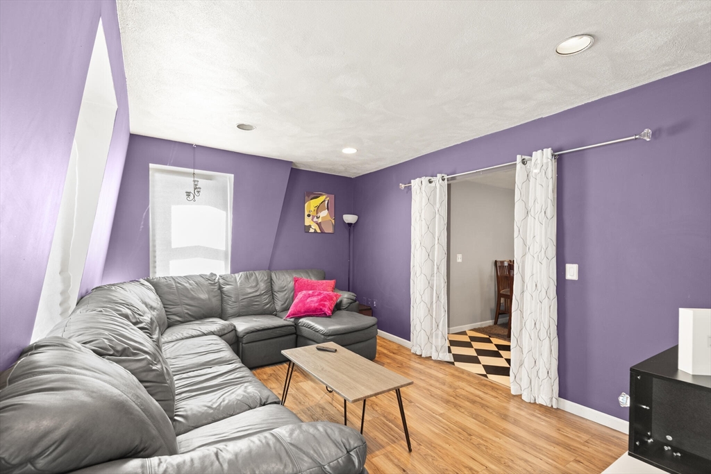 5 Washington Square Gloucester, MA 01930 - Photo 17 of 20 a living room with furniture and a wooden floor
