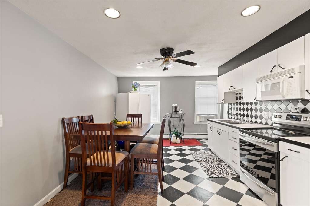 5 Washington Square Gloucester, MA 01930 - Photo 20 of 20 a view of a dining room with furniture and wooden floor