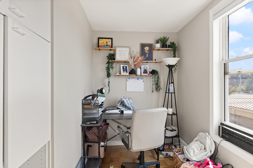 5 Washington Square Gloucester, MA 01930 - Photo 2 of 20 a view of a workspace with furniture and a window