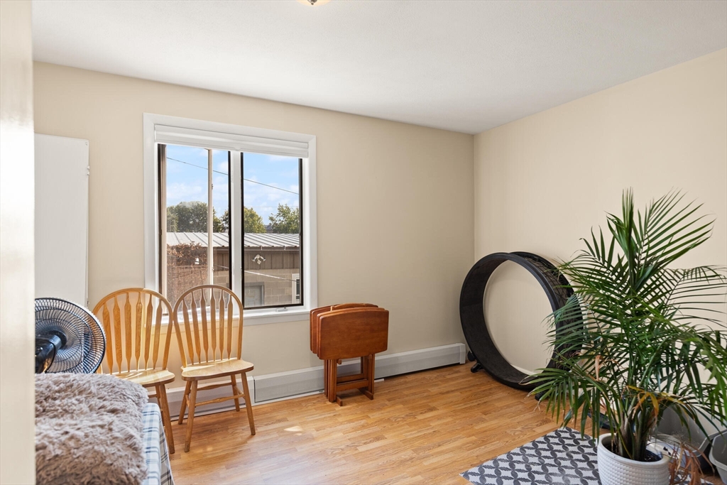 5 Washington Square Gloucester, MA 01930 - Photo 5 of 20 a living room with furniture and a potted plant