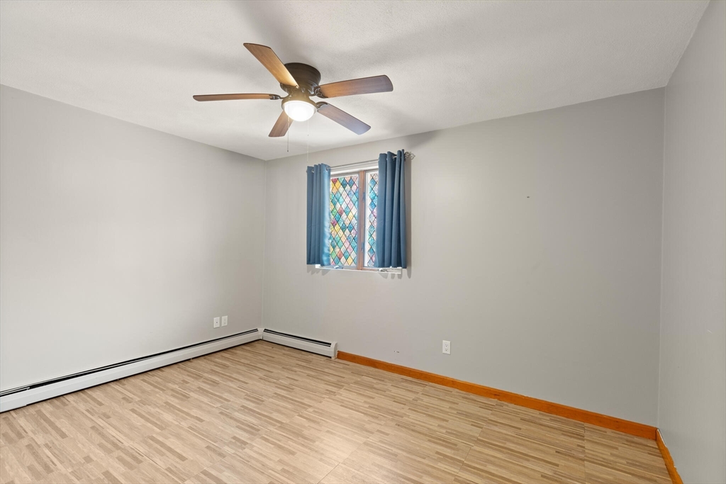 5 Washington Square Gloucester, MA 01930 - Photo 7 of 20 wooden floor in an empty room with a window