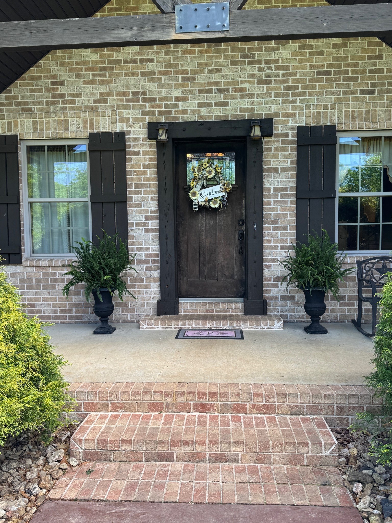 375 Autumn Ridge Lane Lafayette, TN 37083 - Photo 2 of 43 a stone house with potted plants in front of door