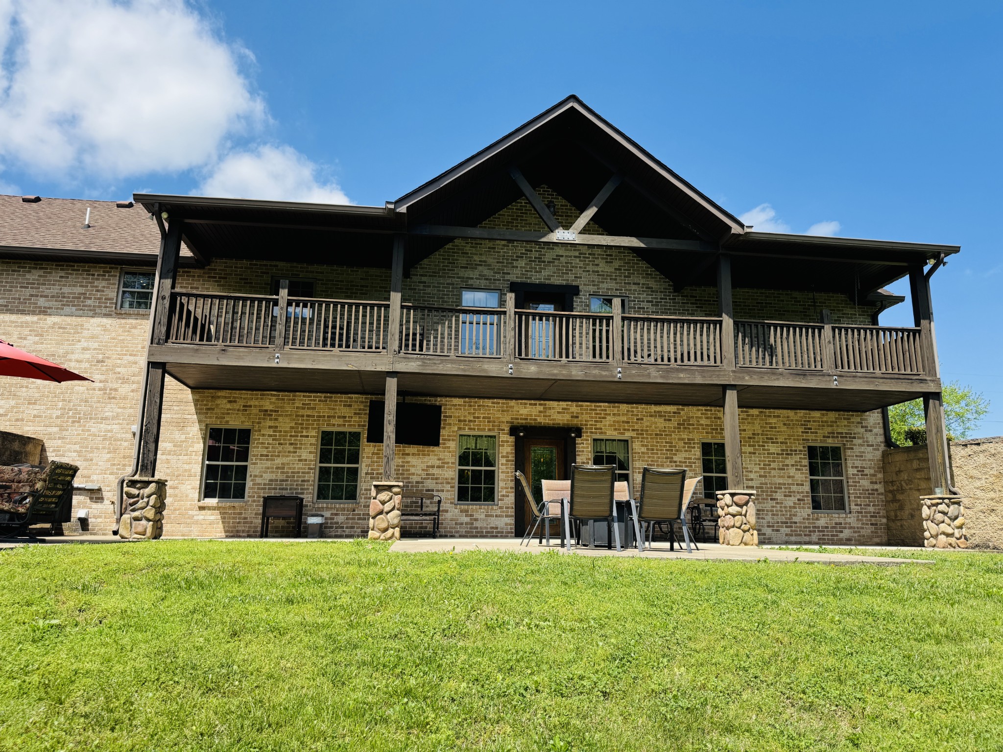 375 Autumn Ridge Lane Lafayette, TN 37083 - Photo 41 of 43 a front view of a house with a yard table and chairs