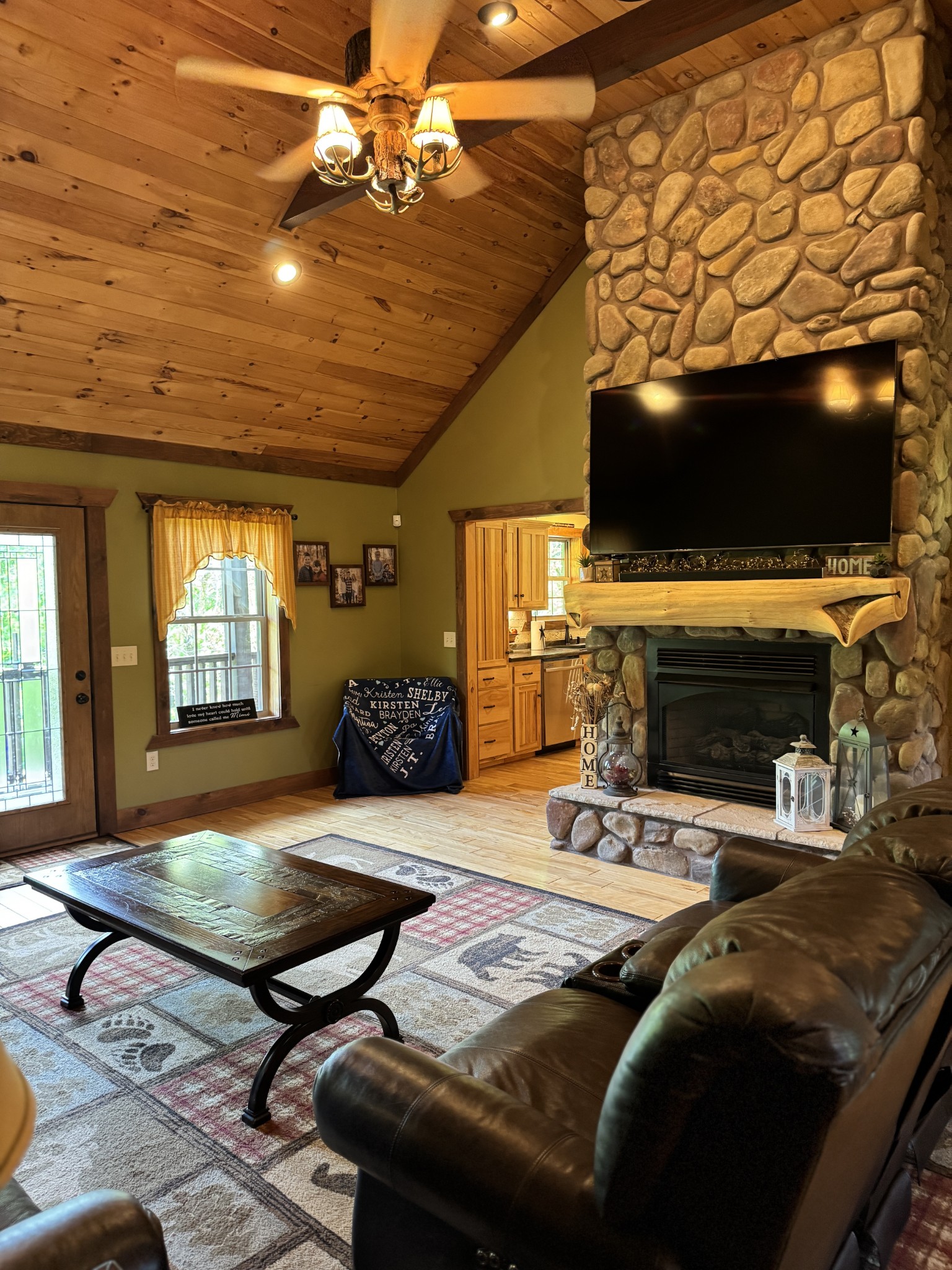 375 Autumn Ridge Lane Lafayette, TN 37083 - Photo 6 of 43 a living room with furniture a flat screen tv and a fireplace