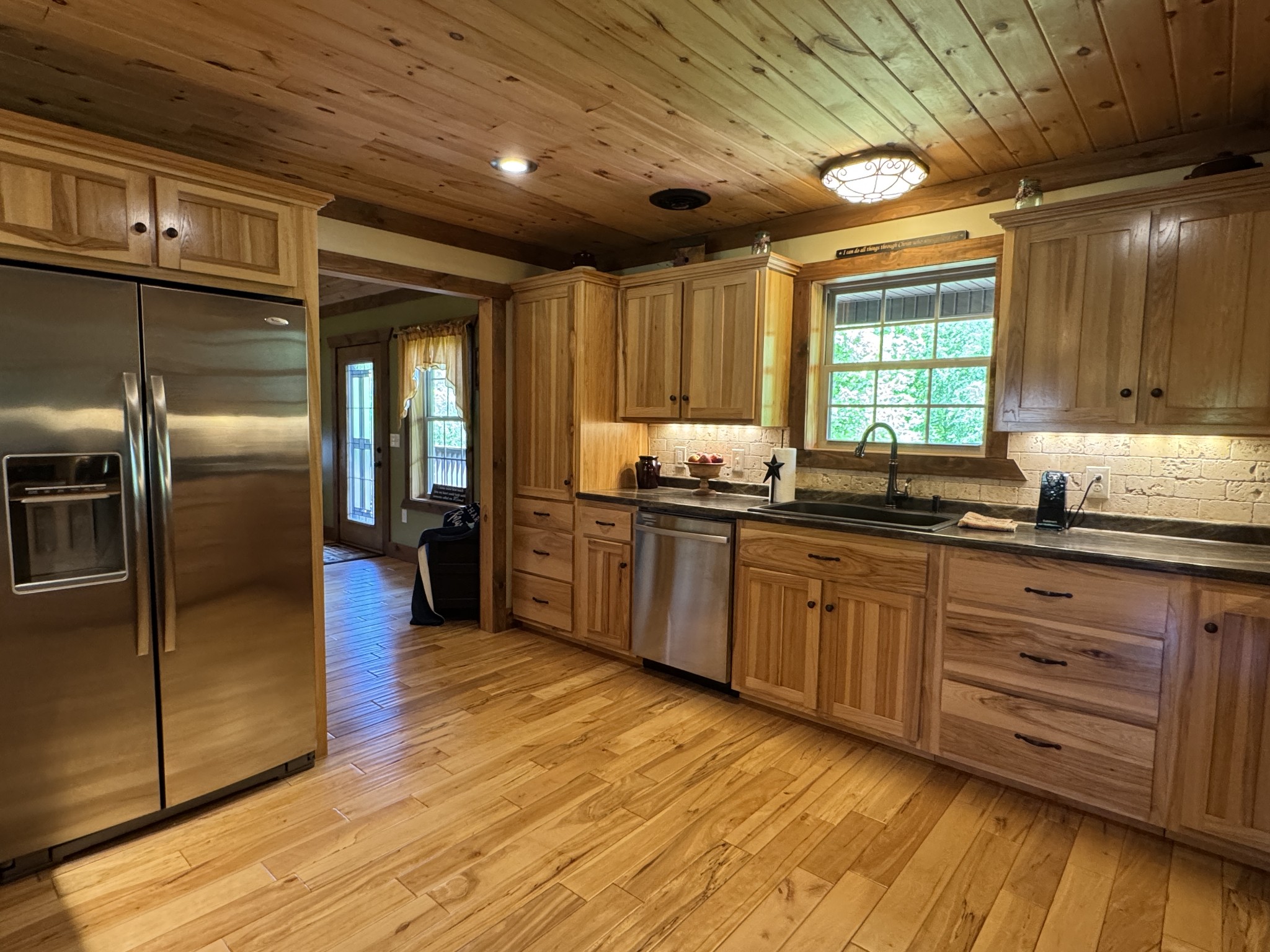 375 Autumn Ridge Lane Lafayette, TN 37083 - Photo 8 of 43 a kitchen with stainless steel appliances granite countertop a sink a stove counter space and cabinets