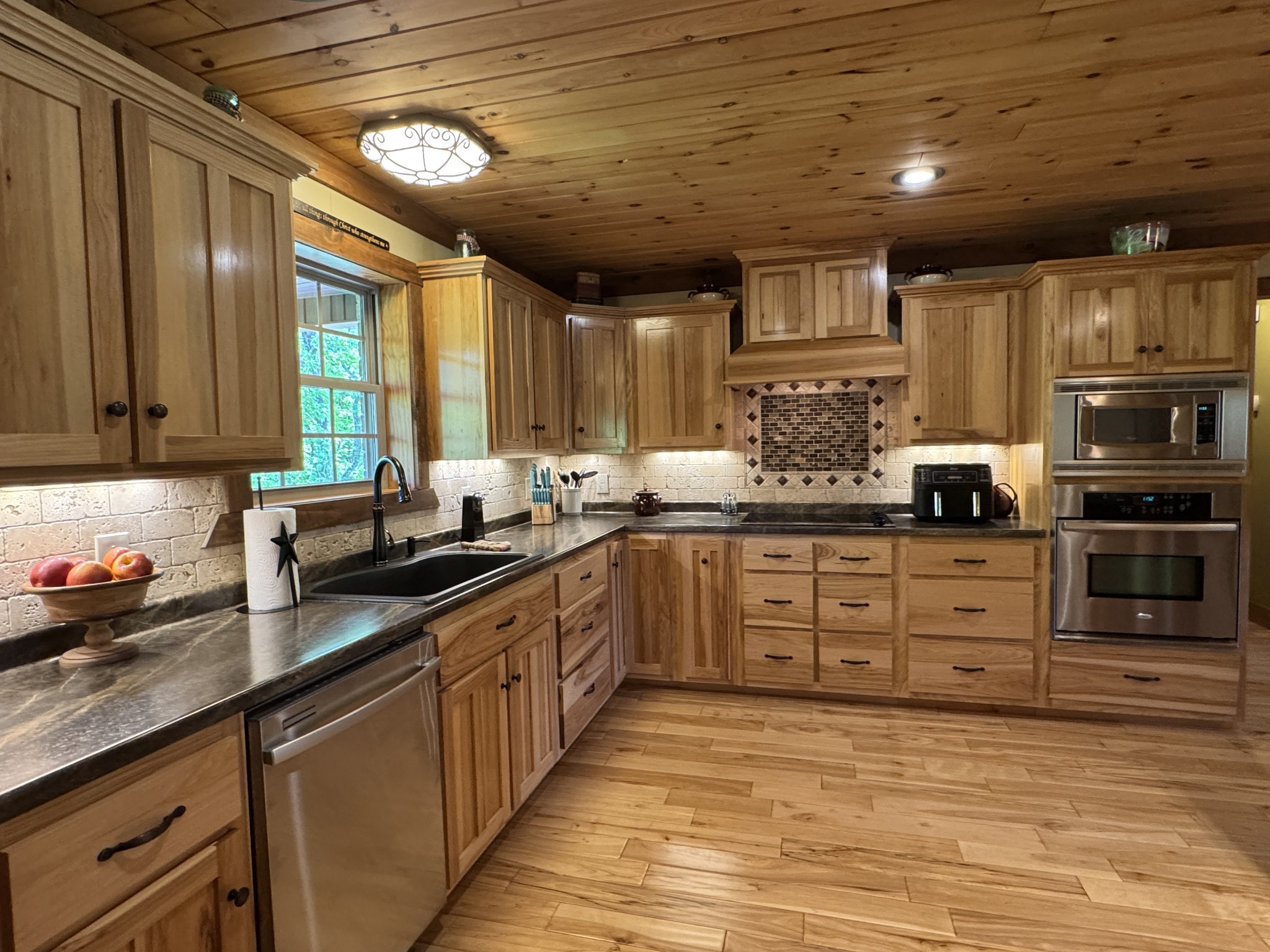 375 Autumn Ridge Lane Lafayette, TN 37083 - Photo 9 of 43 a kitchen with stainless steel appliances granite countertop a sink window and cabinets