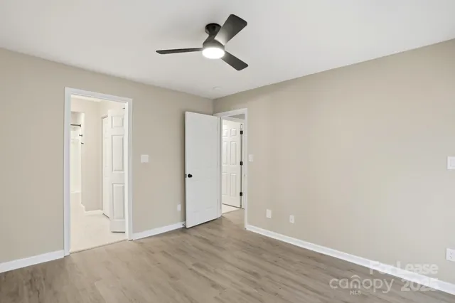 a bathroom with a sink a mirror a toilet and a shower