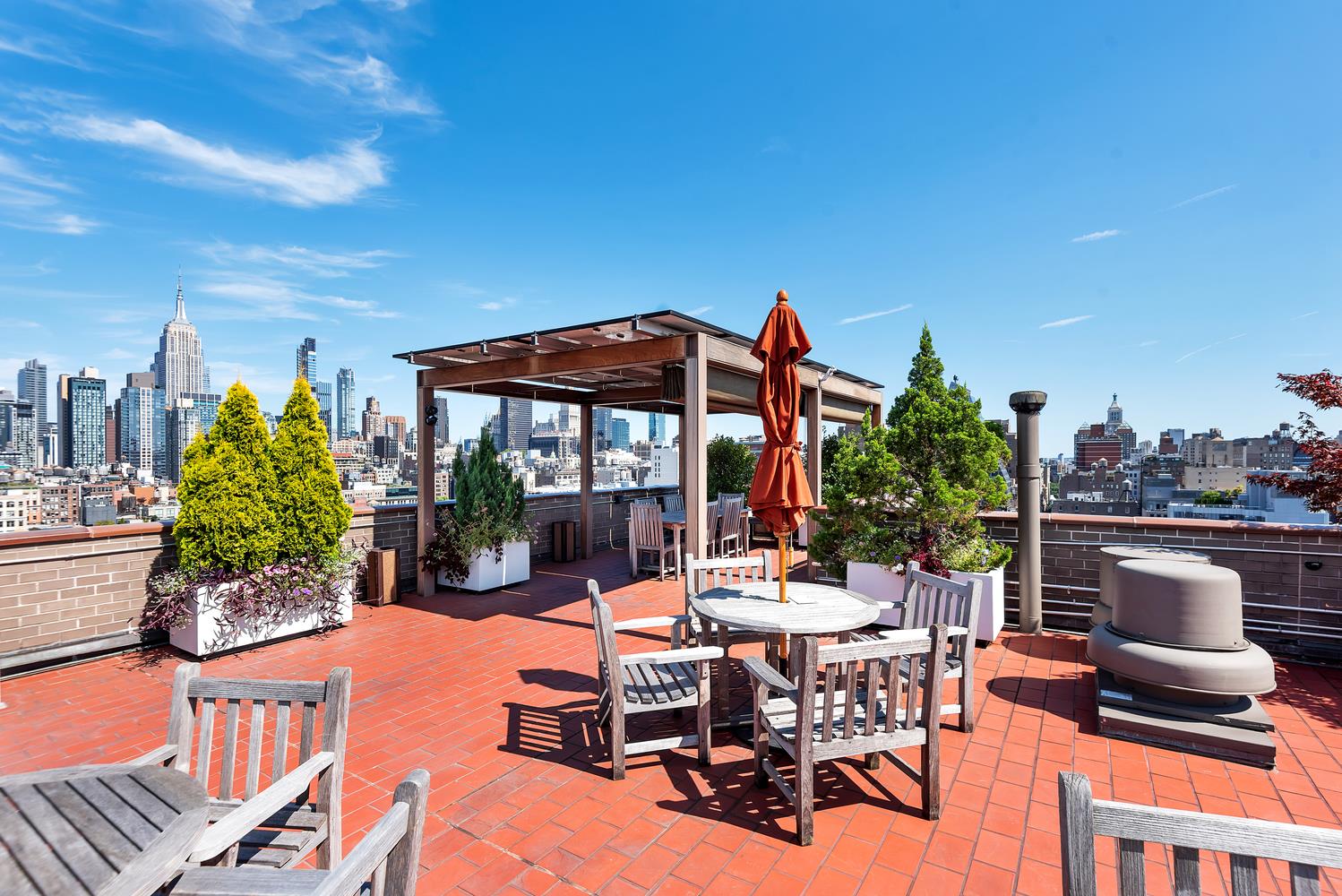 77 7th Avenue, Unit 14L Manhattan, NY 10011 - Photo 8 of 10 a view of a patio with swimming pool