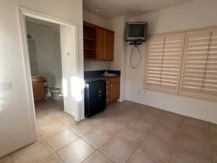 a kitchen with a cabinets and a stove top oven