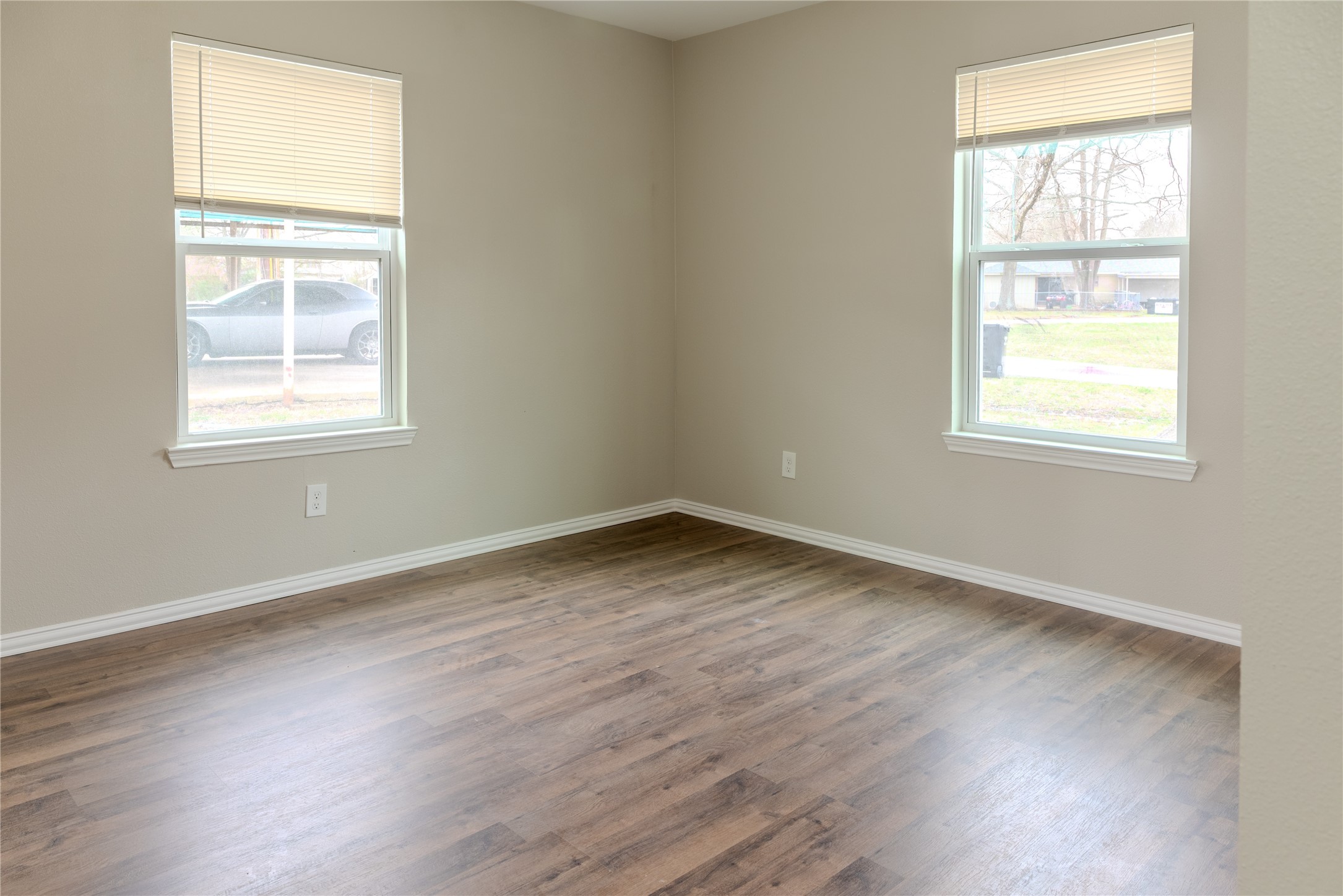 729 Planters Street Emory, TX 75440 - Photo 9 of 22 an empty room with wooden floor and windows