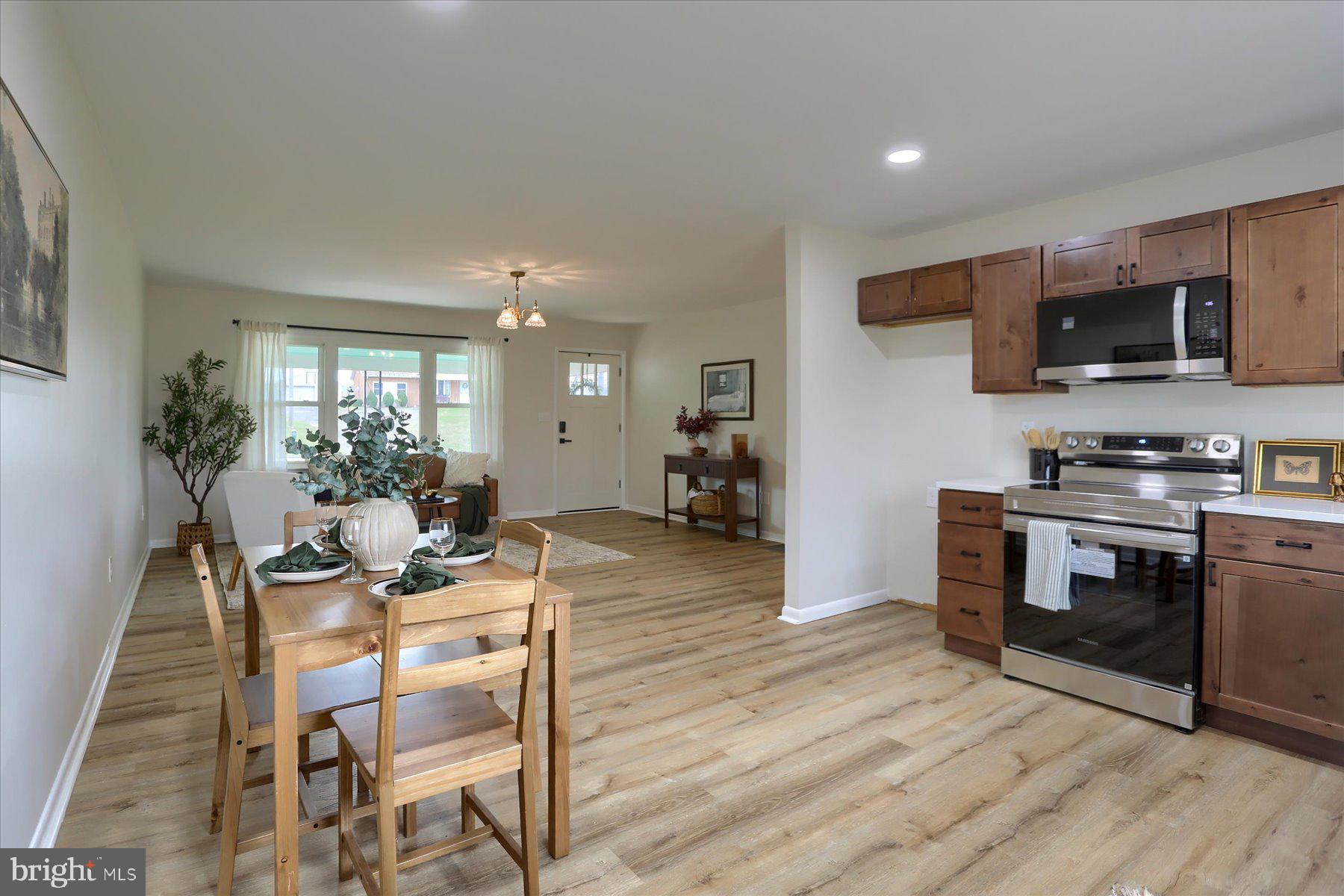 1339 Berrysburg Road Millersburg, PA 17061 - Photo 12 of 42 a view of kitchen with microwave stove refrigerator and cabinets