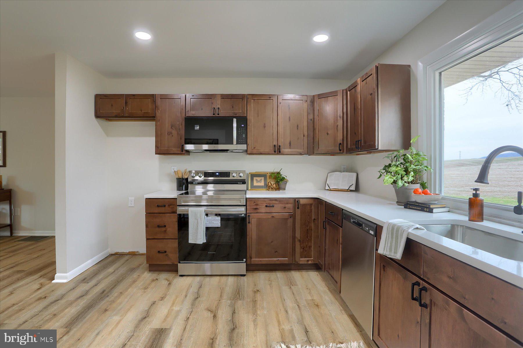 1339 Berrysburg Road Millersburg, PA 17061 - Photo 14 of 42 a kitchen with sink a microwave and cabinets