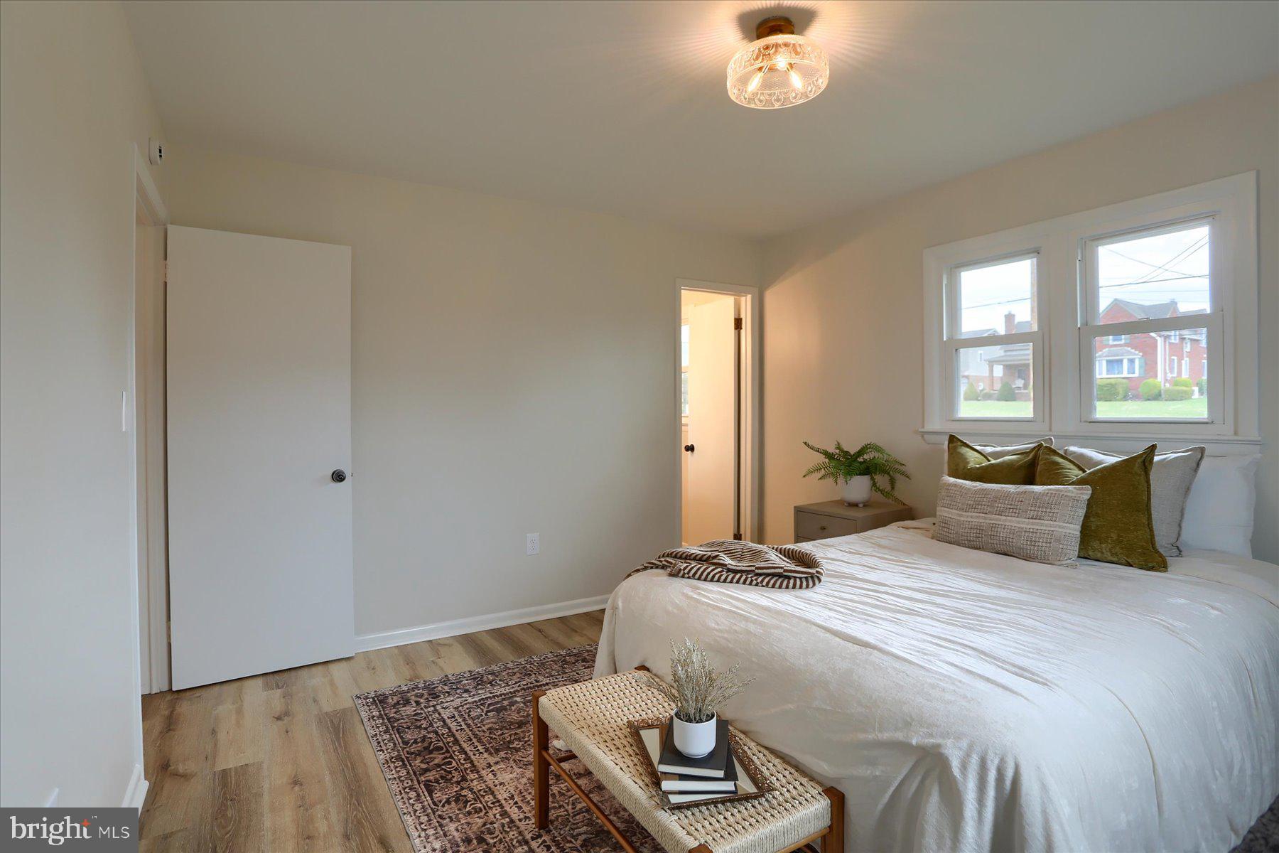 1339 Berrysburg Road Millersburg, PA 17061 - Photo 26 of 42 a bedroom with a bed and a chandelier