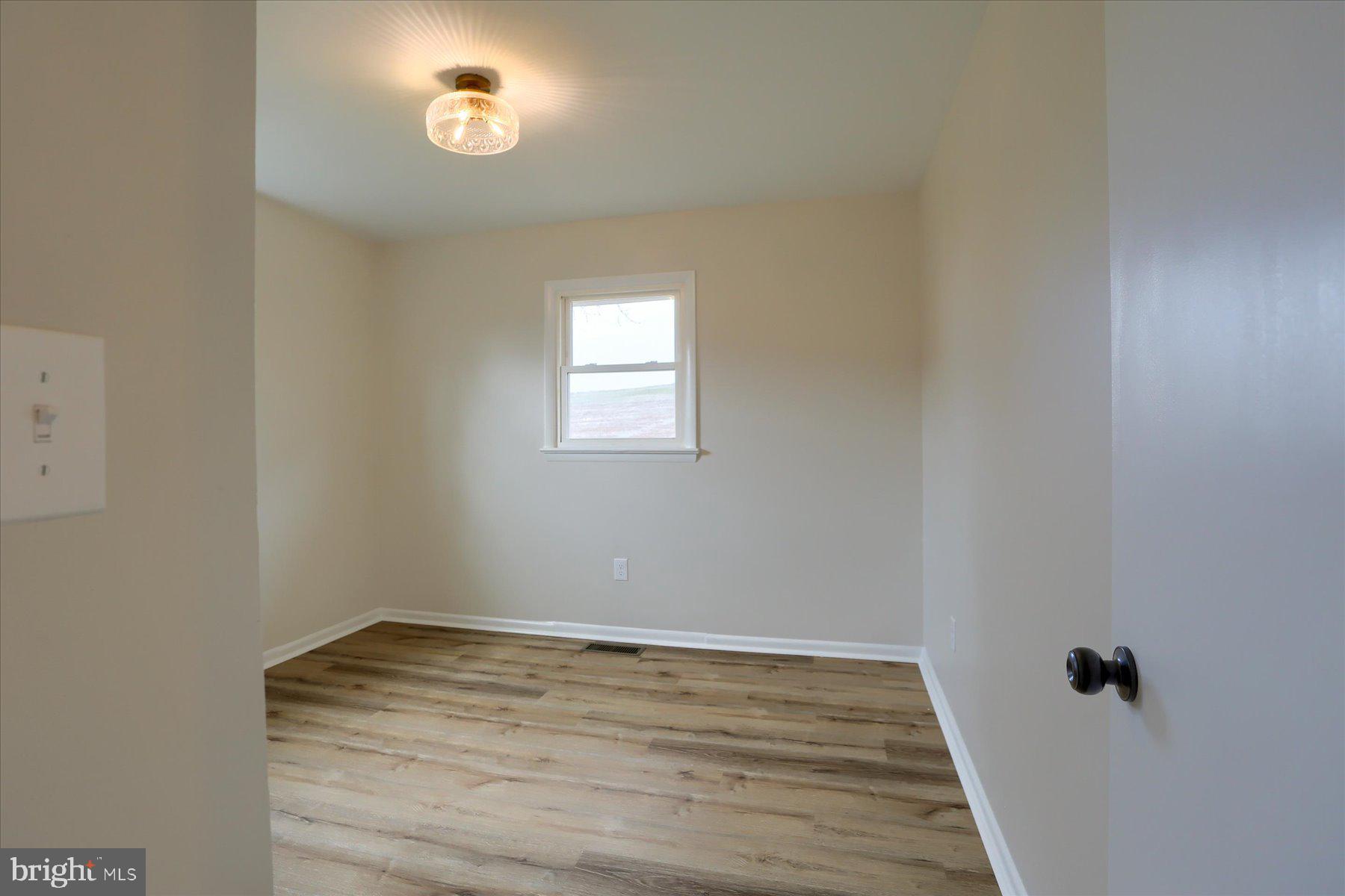 1339 Berrysburg Road Millersburg, PA 17061 - Photo 28 of 42 wooden floor in an empty room with a window