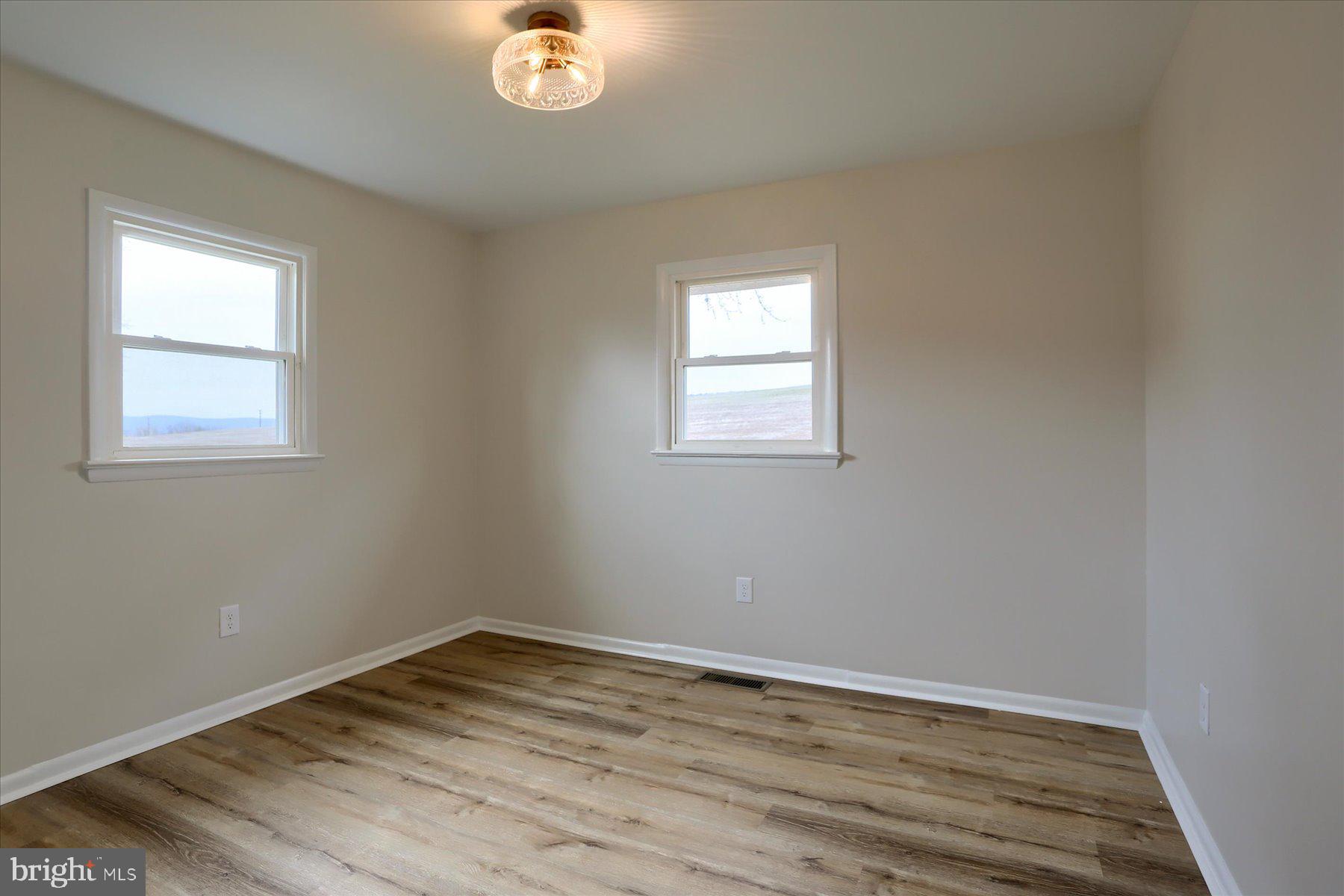 1339 Berrysburg Road Millersburg, PA 17061 - Photo 29 of 42 an empty room with wooden floor and windows
