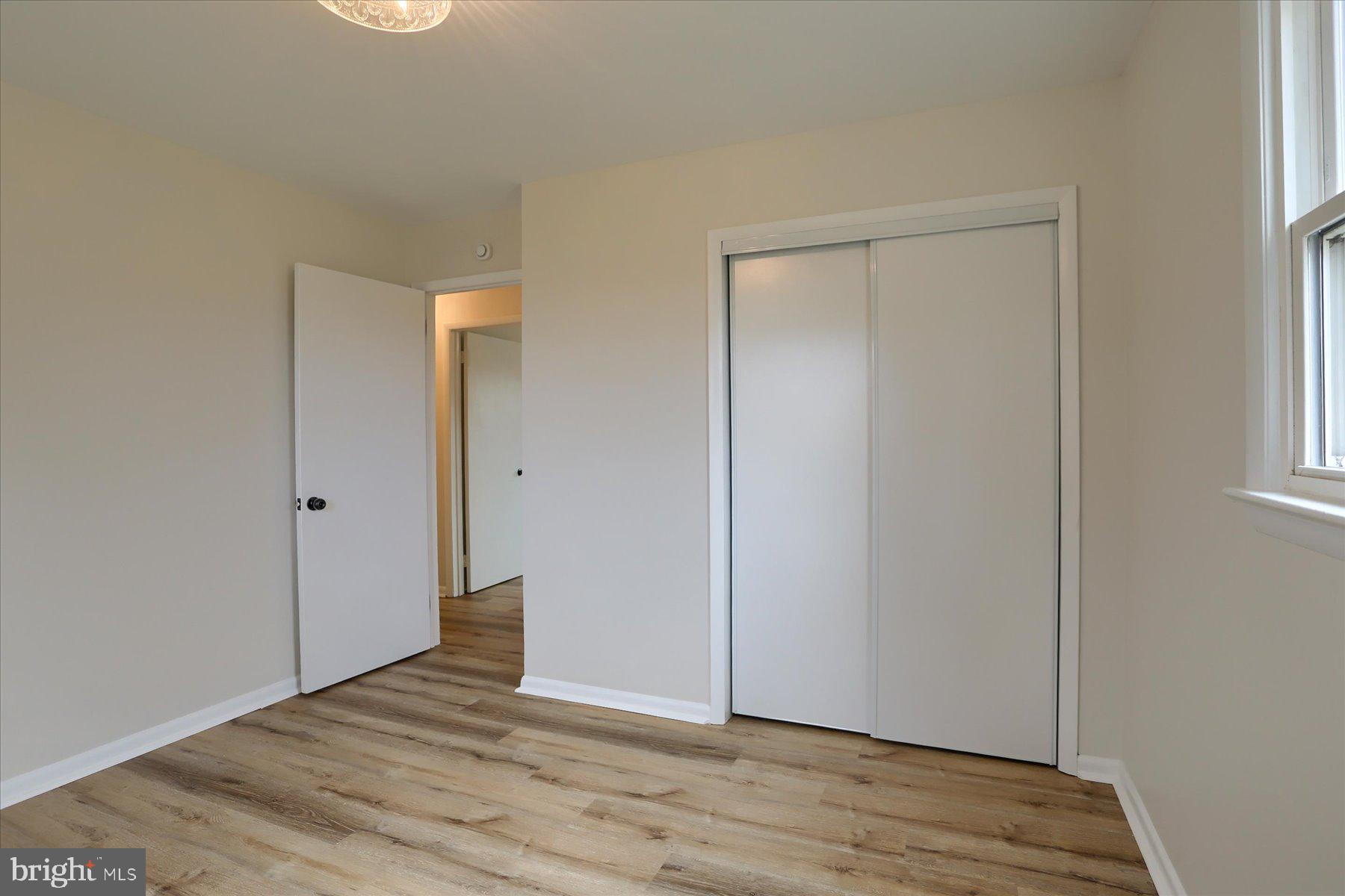 1339 Berrysburg Road Millersburg, PA 17061 - Photo 30 of 42 a view of an empty room with wooden floor and a window