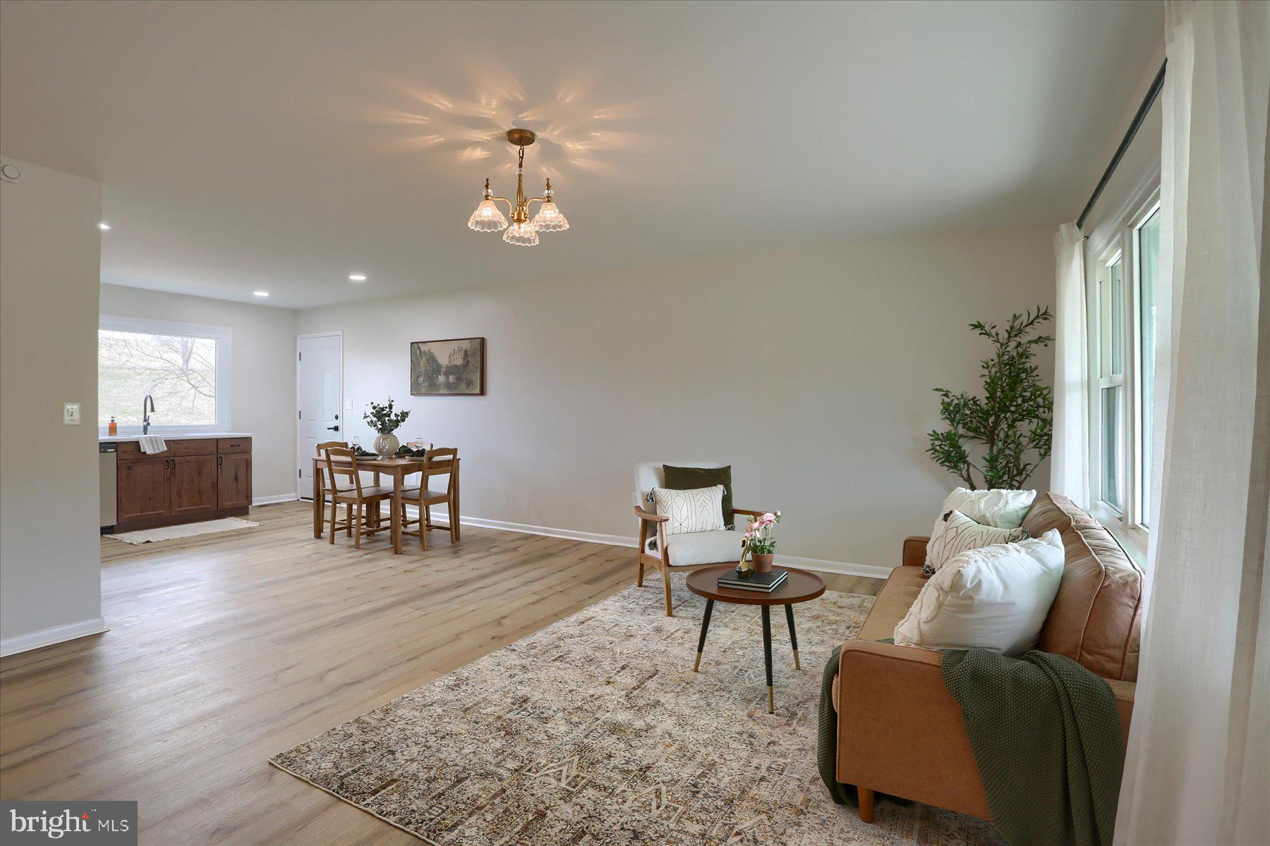 1339 Berrysburg Road Millersburg, PA 17061 - Photo 7 of 42 a living room with furniture and a chandelier