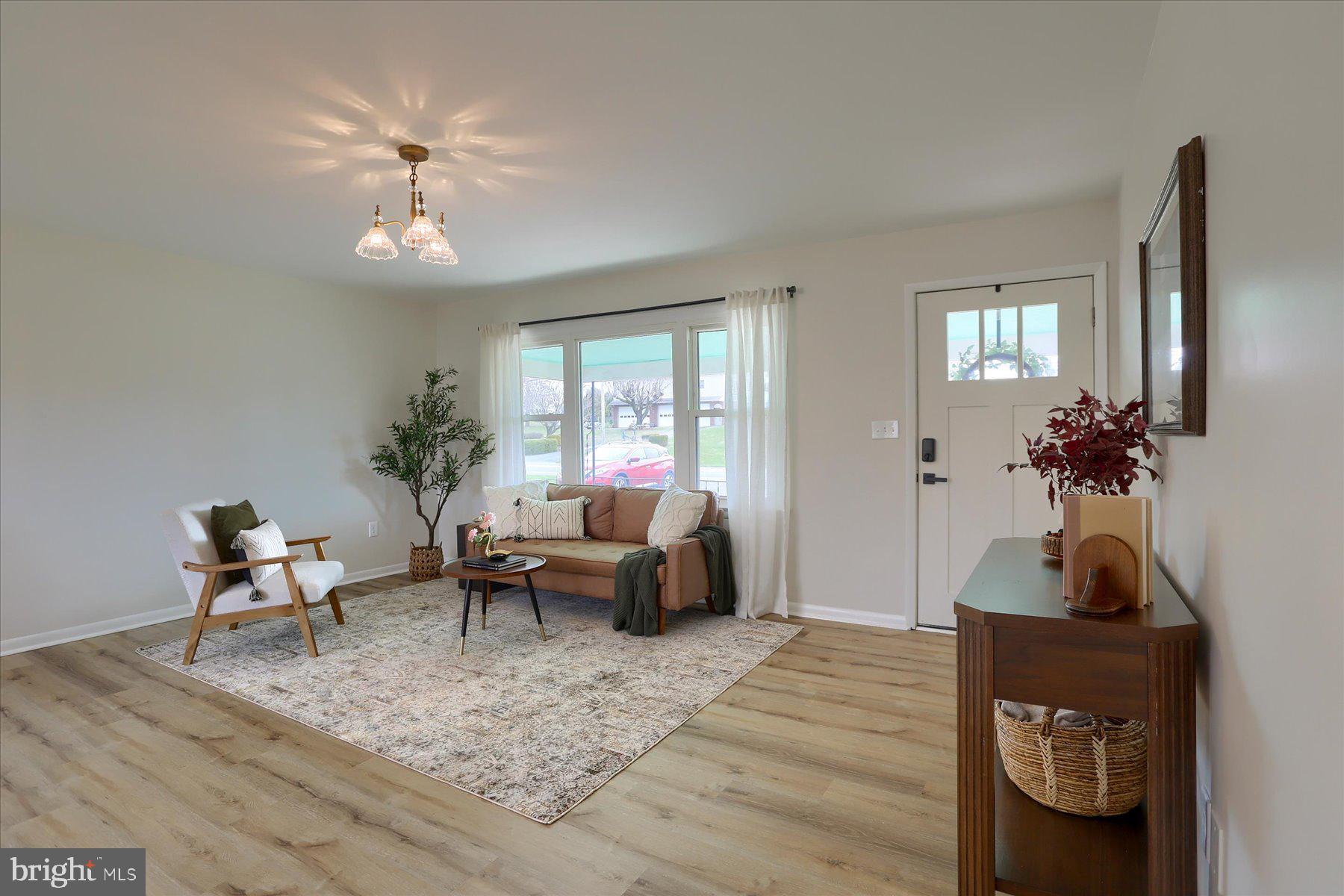 1339 Berrysburg Road Millersburg, PA 17061 - Photo 8 of 42 a living room with furniture and a potted plant