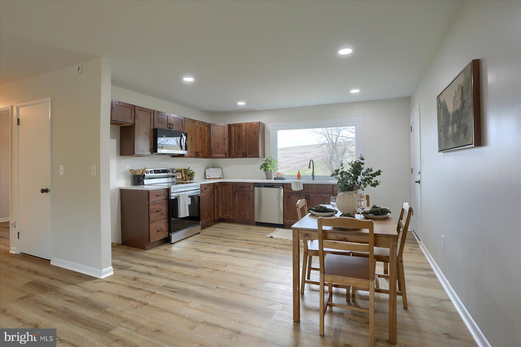 1339 Berrysburg Road Millersburg, PA 17061 - Photo 10 of 42 a kitchen with kitchen island wooden cabinets and counter space