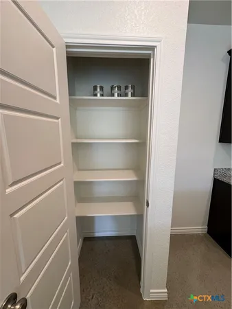 a kitchen with sink granite counter top and a granite counter top