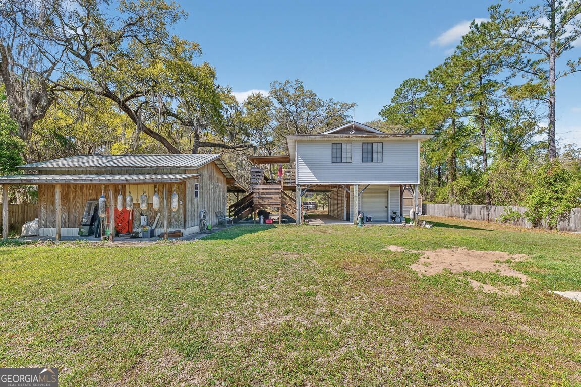 33 Warren Avenue Waverly, GA 31565 - Photo 37 of 63 a view of a house with a yard and sitting area