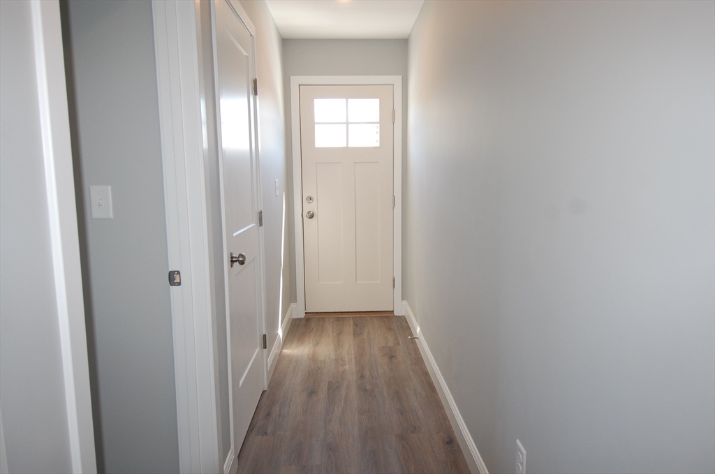 9 Bolton Road, Unit S Dartmouth, MA 02748 - Photo 8 of 19 a view of a hallway with wooden floor