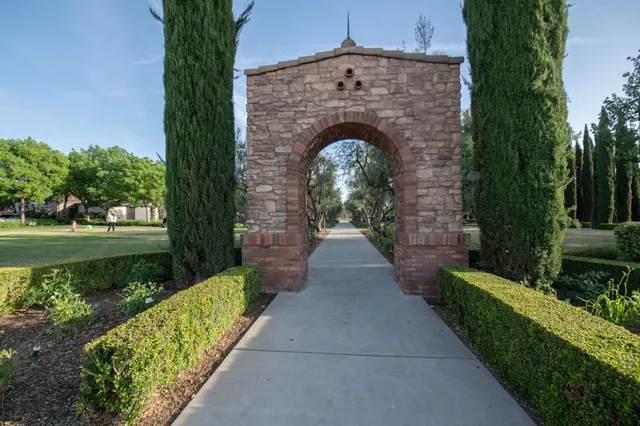 a view of a pathway with a yard