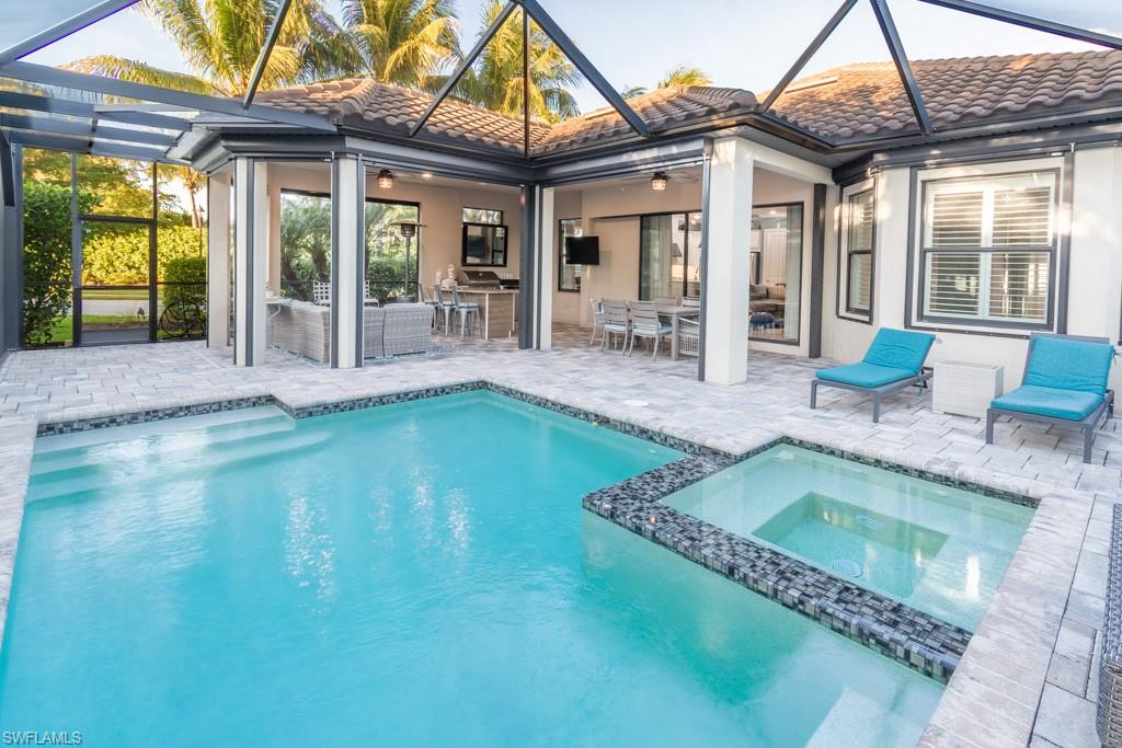 a swimming pool with patio outdoor seating and yard