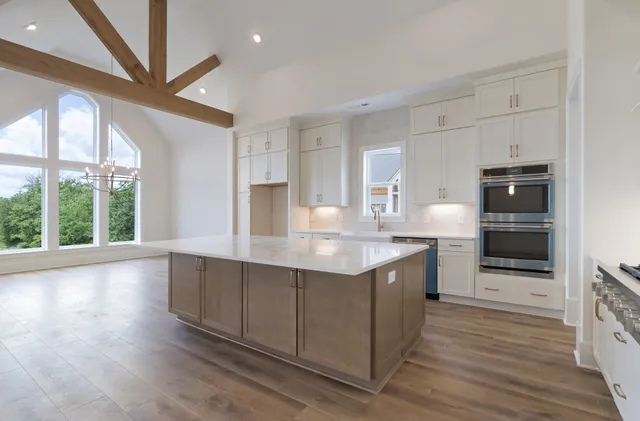 a kitchen with a sink and cabinets