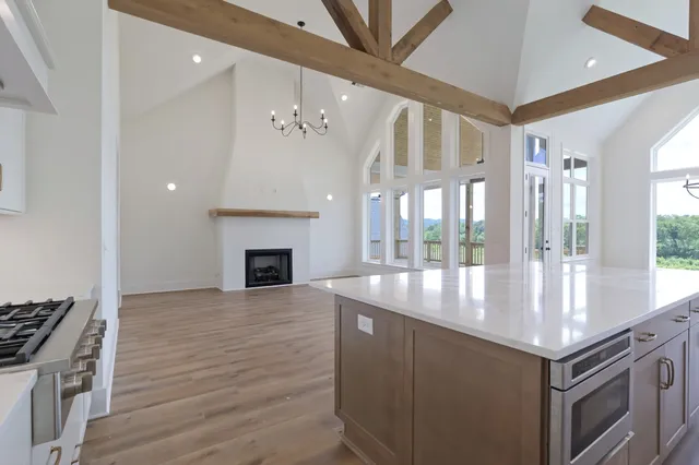 a kitchen with granite countertop a stove and a refrigerator