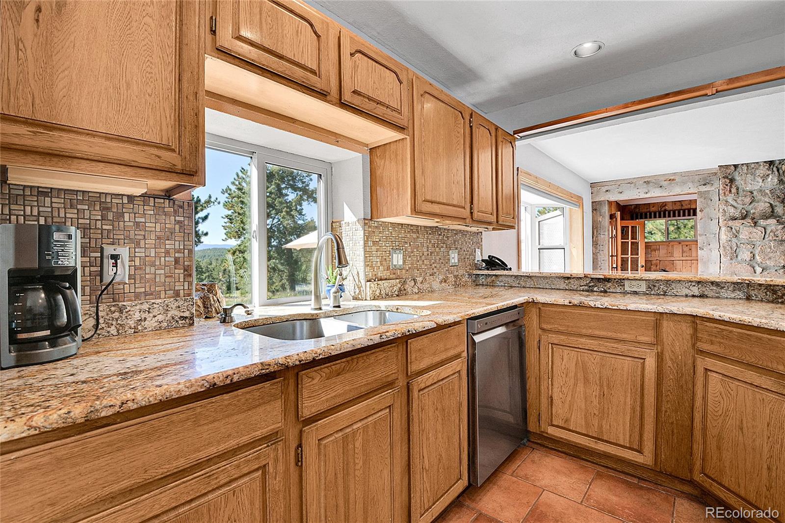 13082 South Wamblee Valley Road Conifer, CO 80433 - Photo 8 of 35 a kitchen with sink and window