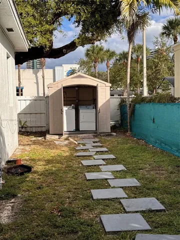 a backyard of a house with lots of green space