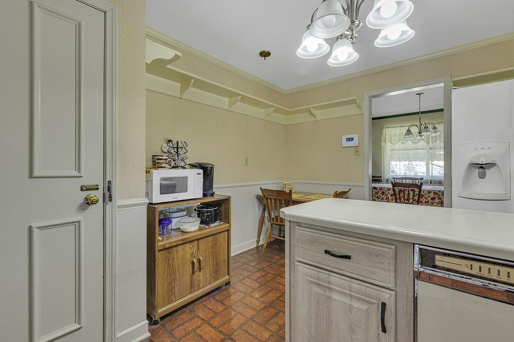 4178 South R 1022 New Brighton, PA 15066 - Photo 12 of 33 a kitchen that has a lot of cabinets in it